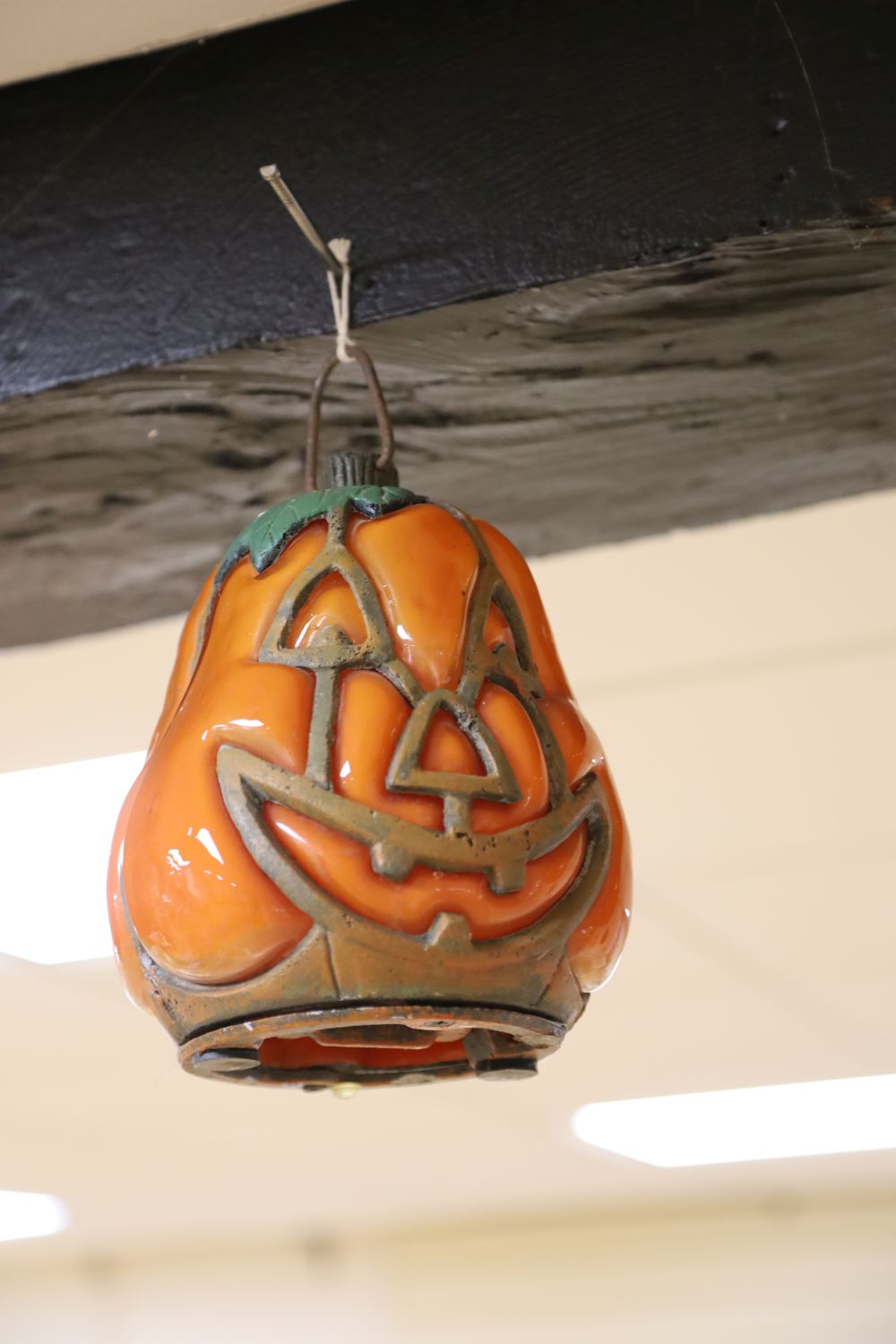 A collection of eight vintage glass and painted metal Halloween pumpkin lanterns, various